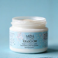 A jar of 'Hydra-Glow' face cream with a light blue and white label, featuring a delicate floral design and pearl-like texture.